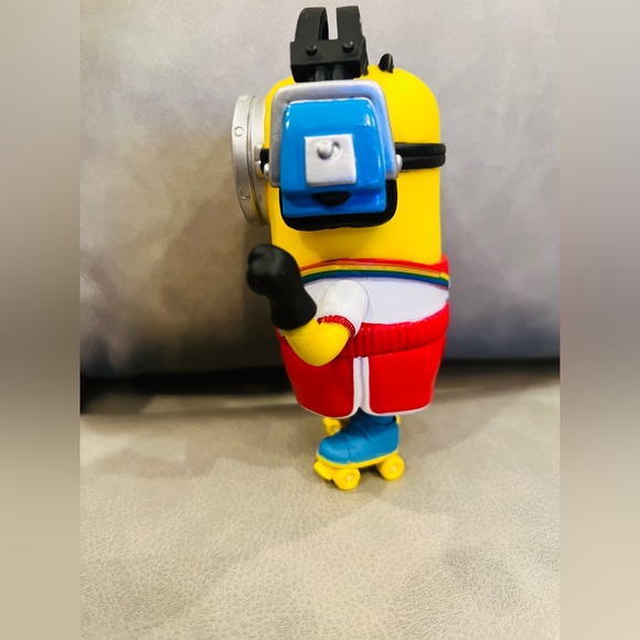 Despicable me figure Tim rollerskating with head phones. - Picture 3 of 4